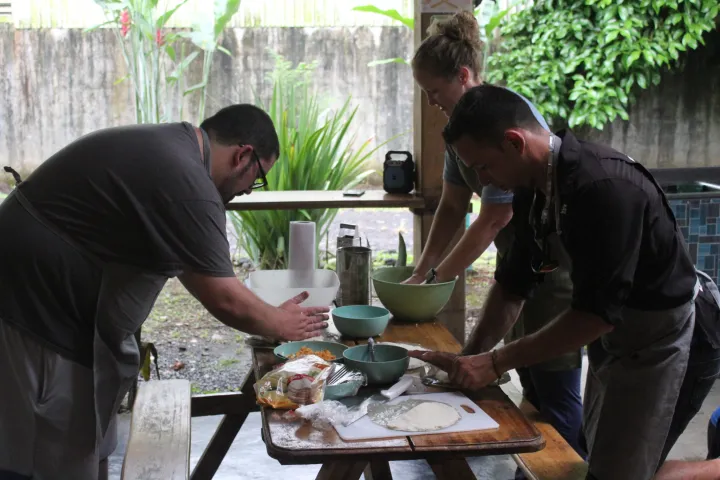 a man cooking food on a table