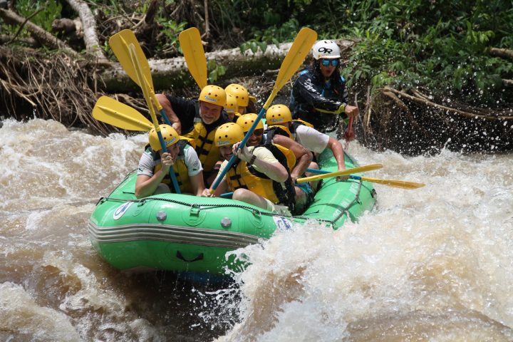 a group of people on a raft in a pool of water