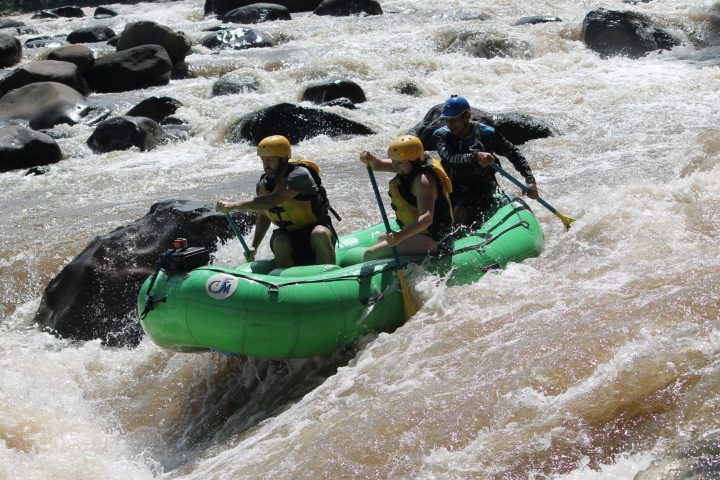 a group of people on a raft in the snow