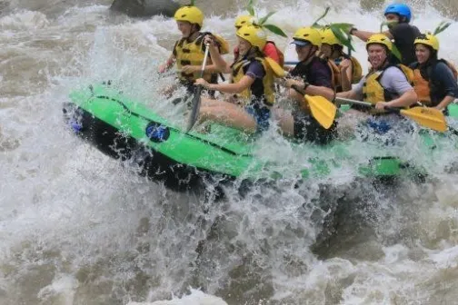 people in green raft white water rafting the Saraquipi river