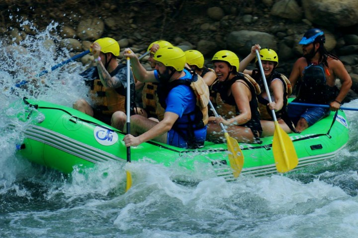 group of people white water rafting Toro River