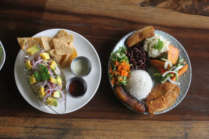 a plate of food sitting on top of a wooden table