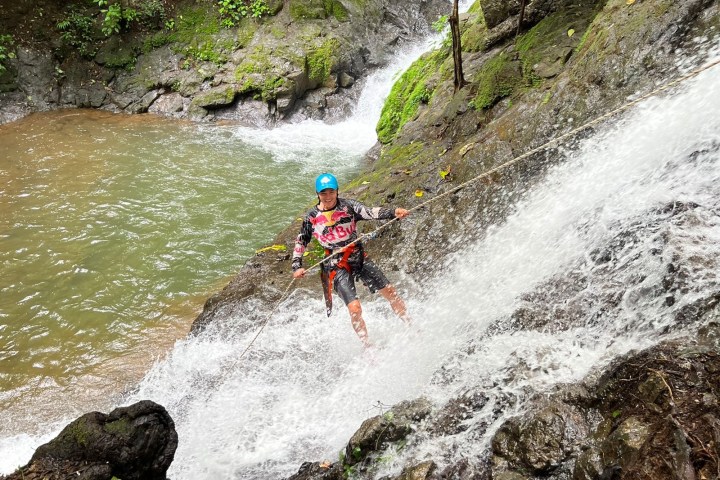 a man riding on the back of a waterfall