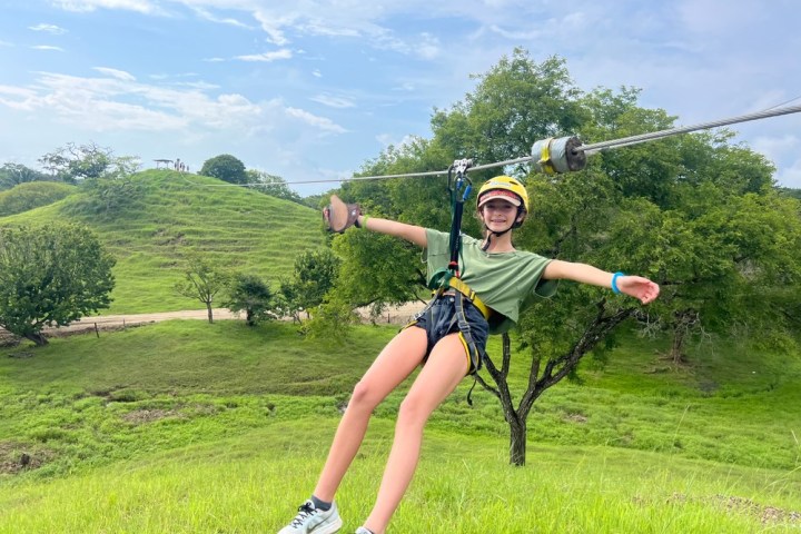 a person holding a bat on a field