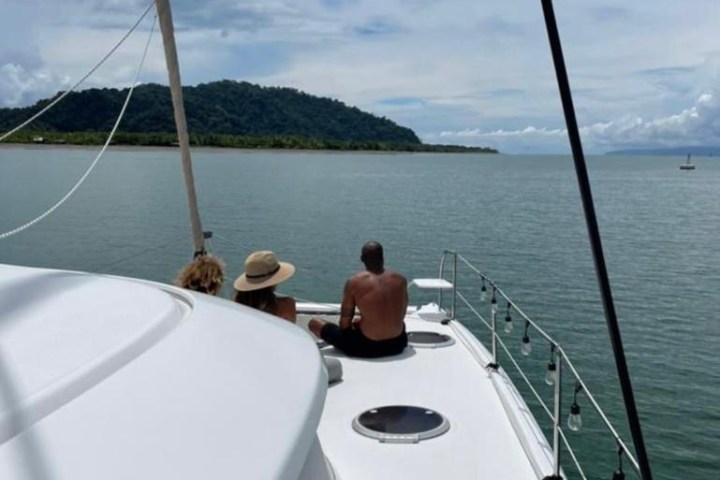 a boat is docked next to a body of water