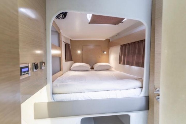 a bedroom with a bed and a mirror
